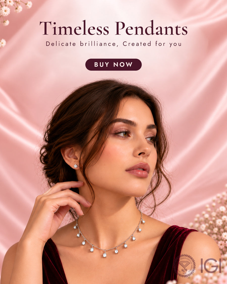 A woman wearing a delicate silver lab grown diamond pendant necklace and matching stud earring against a pink satin background with the text Timeless Pendants and a BUY NOW button